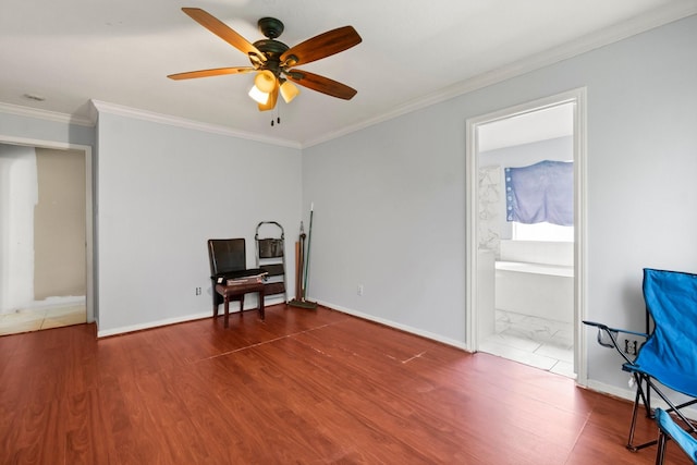 6619 Amberfield Ln, Katy, TX 77449 - living room with wood finished floors, ceiling fan, and ornamental molding