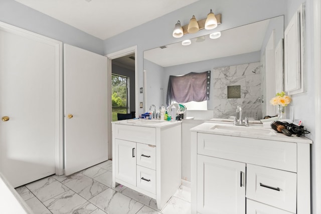 6619 Amberfield Ln, Katy, TX 77449 - full bath with two vanities, marble look tile flooring, and a shower