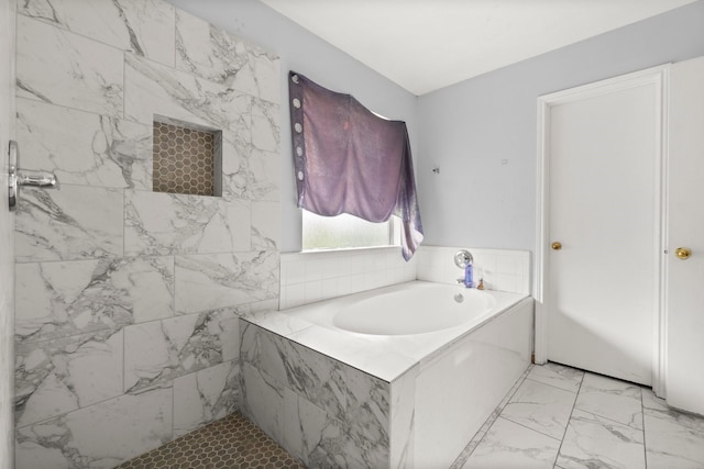 6619 Amberfield Ln, Katy, TX 77449 - bathroom featuring a bath and marble finish flooring