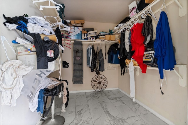 6619 Amberfield Ln, Katy, TX 77449 - walk in closet with marble look tiles and vaulted ceiling