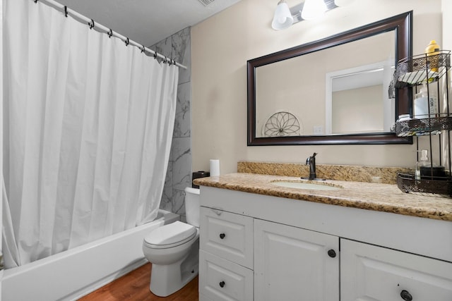 6619 Amberfield Ln, Katy, TX 77449 - full bathroom with vanity, shower / bath combo with shower curtain, and wood finished floors