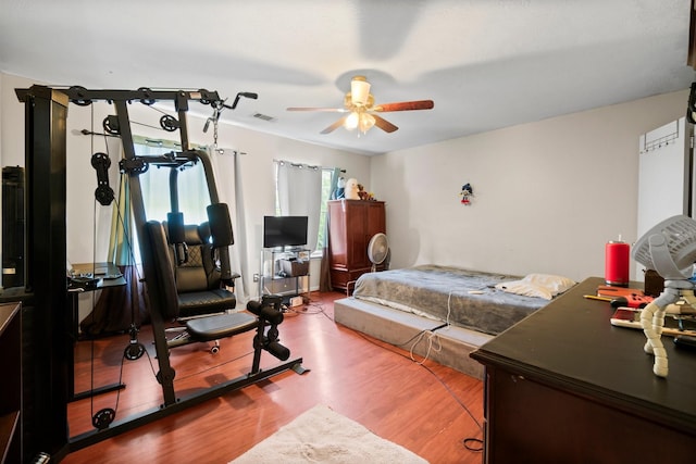 6619 Amberfield Ln, Katy, TX 77449 - bedroom featuring wood finished floors and ceiling fan
