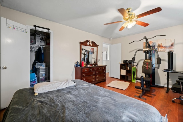 6619 Amberfield Ln, Katy, TX 77449 - bedroom with wood finished floors, a closet, and ceiling fan