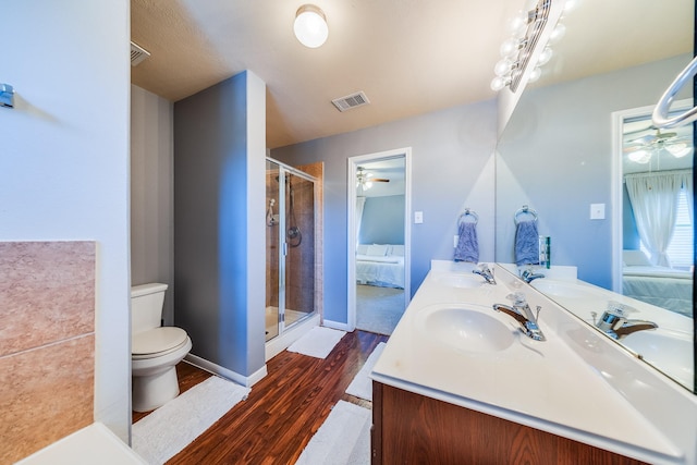 9415 Cholla Hill Ct, Houston, TX 77064 - full bathroom with wood finished floors, ceiling fan, double vanity, and a shower stall