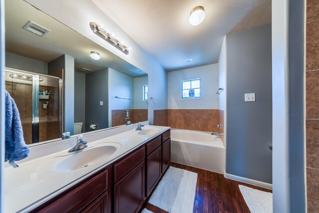 9415 Cholla Hill Ct, Houston, TX 77064 - full bath with wood finished floors, a garden tub, double vanity, and a shower with door