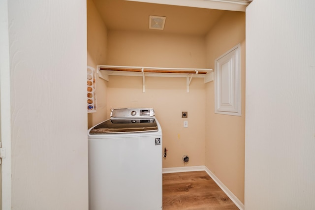 9415 Cholla Hill Ct, Houston, TX 77064 - laundry area with washer / dryer and light wood finished floors