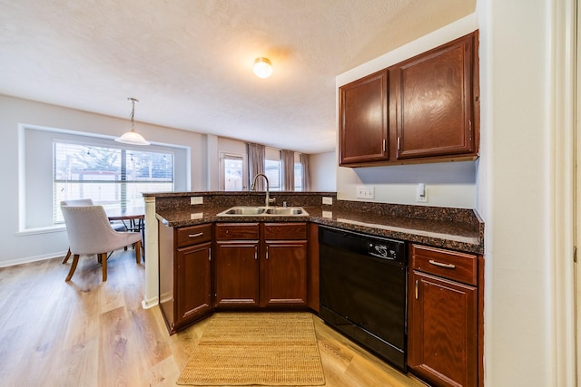 9415 Cholla Hill Ct, Houston, TX 77064 - kitchen with dishwasher, a peninsula, light wood finished floors, dark stone counters, and decorative light fixtures