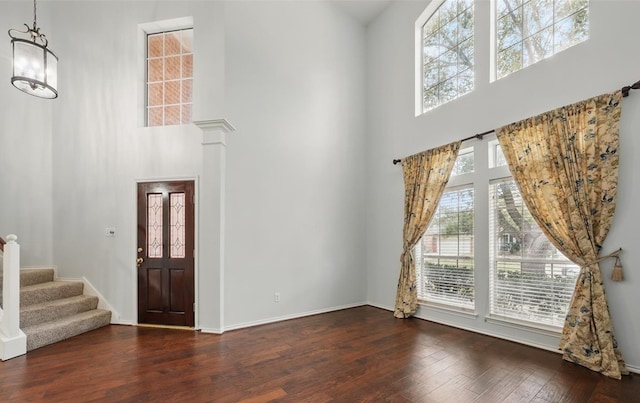 21331 Willow Glade Dr, Katy, TX 77450 - entrance foyer with a high ceiling, wood-type flooring, a chandelier, and stairway