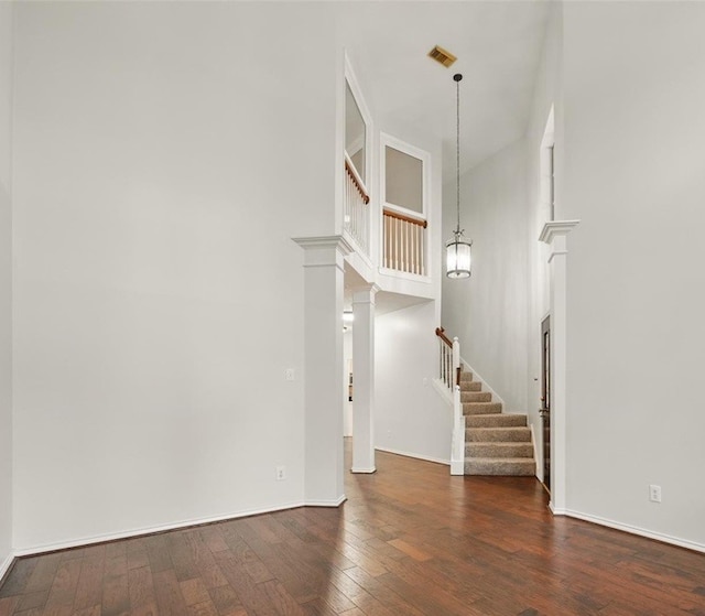 21331 Willow Glade Dr, Katy, TX 77450 - unfurnished living room with stairway and wood finished floors