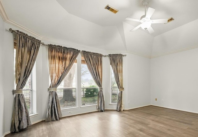 21331 Willow Glade Dr, Katy, TX 77450 - empty room with wood finished floors, ceiling fan, and vaulted ceiling