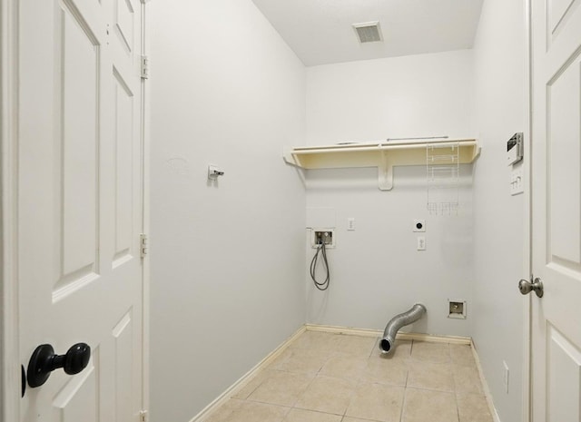 21331 Willow Glade Dr, Katy, TX 77450 - laundry room with electric dryer hookup, hookup for a washing machine, and tile patterned floors