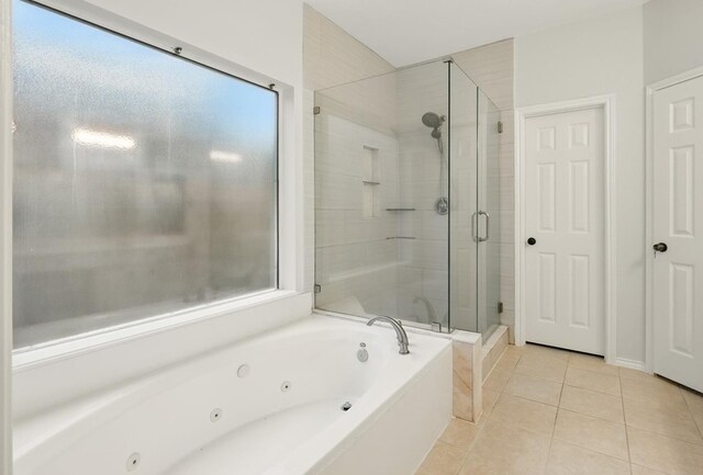 21331 Willow Glade Dr, Katy, TX 77450 - bathroom featuring a whirlpool tub, tile patterned floors, and a shower stall