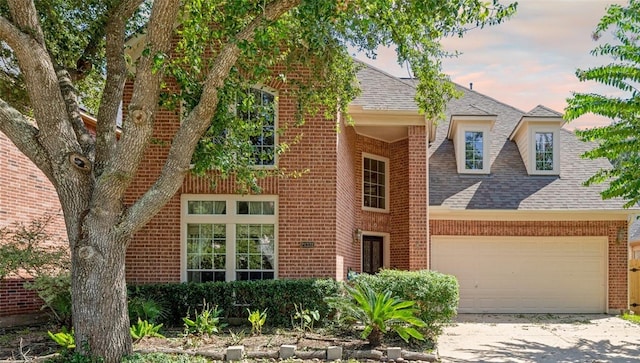 21331 Willow Glade Dr, Katy, TX 77450 - view of front of home with a garage, concrete driveway, brick siding, and roof with shingles