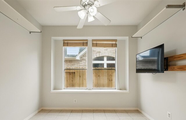 21331 Willow Glade Dr, Katy, TX 77450 - tiled empty room with a ceiling fan and baseboards