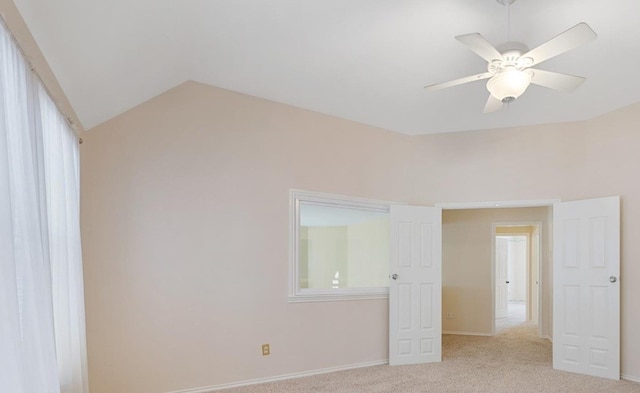 21331 Willow Glade Dr, Katy, TX 77450 - unfurnished bedroom with light carpet, vaulted ceiling, and ceiling fan