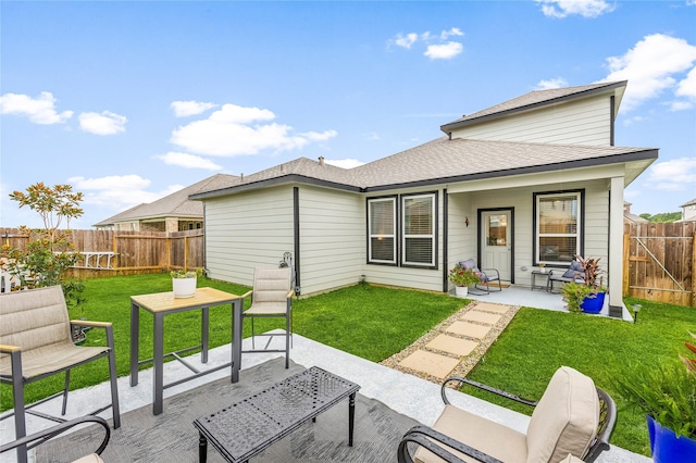 308 Spruce Oak Ln, Waller, TX 77484 - back of property with a fenced backyard, a patio area, and roof with shingles