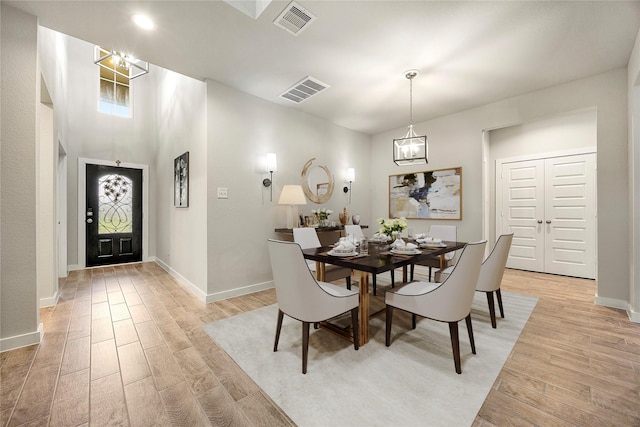 308 Spruce Oak Ln, Waller, TX 77484 - dining space featuring light wood finished floors and a chandelier