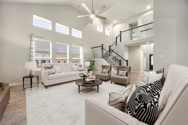 308 Spruce Oak Ln, Waller, TX 77484 - living room featuring high vaulted ceiling, light wood-type flooring, ceiling fan, and recessed lighting