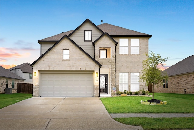 308 Spruce Oak Ln, Waller, TX 77484 - traditional home with driveway, a front yard, stone siding, roof with shingles, and an attached garage