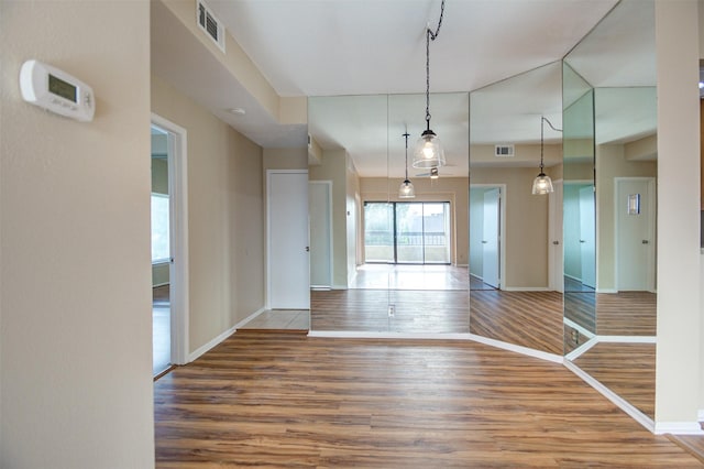 2213 S Braeswood Blvd Unit 13C, Houston, TX 77030 - empty room featuring wood finished floors