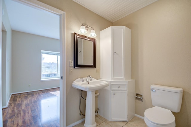 2213 S Braeswood Blvd Unit 13C, Houston, TX 77030 - half bathroom featuring toilet and wood finished floors