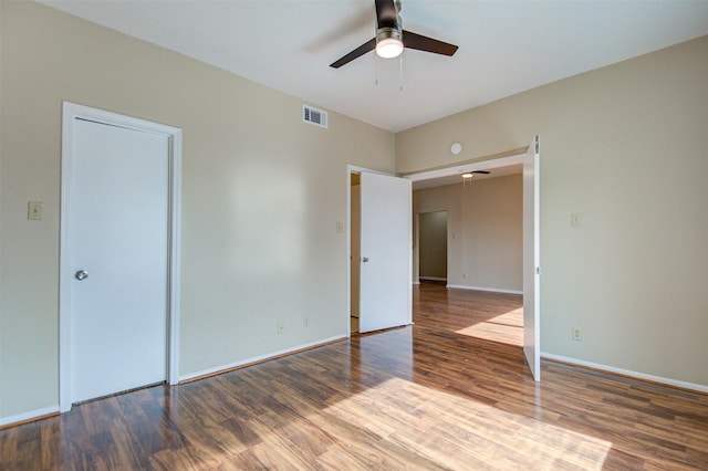 2213 S Braeswood Blvd Unit 13C, Houston, TX 77030 - unfurnished bedroom featuring wood finished floors and ceiling fan