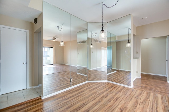 2213 S Braeswood Blvd Unit 13C, Houston, TX 77030 - unfurnished room with light wood-type flooring and ceiling fan