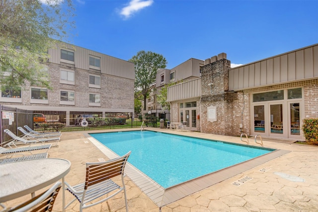 2213 S Braeswood Blvd Unit 13C, Houston, TX 77030 - community pool with a patio and french doors
