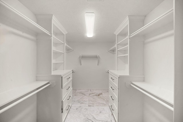 4302 Wigton Dr, Houston, TX 77096 - spacious closet featuring light marble finish floors