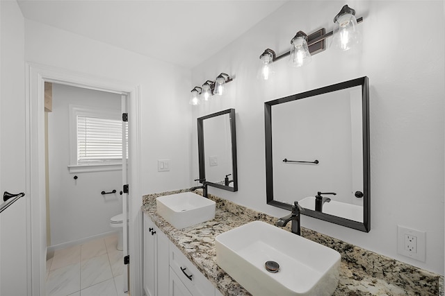 4302 Wigton Dr, Houston, TX 77096 - full bathroom featuring marble look tile flooring and double vanity