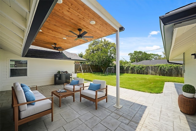 4302 Wigton Dr, Houston, TX 77096 - fenced backyard featuring a ceiling fan, a patio, and outdoor lounge area