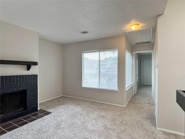 12991 Wirevine Ln, Houston, TX 77072 - unfurnished living room featuring attic access, carpet, a textured ceiling, and a brick fireplace