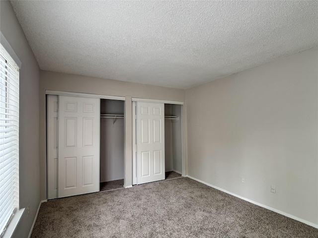 12991 Wirevine Ln, Houston, TX 77072 - unfurnished bedroom with carpet flooring and a textured ceiling