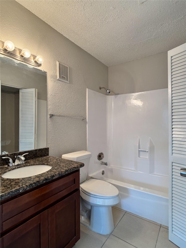 12991 Wirevine Ln, Houston, TX 77072 - full bath with a textured wall, a textured ceiling, vanity, tile patterned floors, and  shower combination