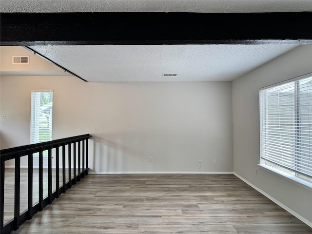 12991 Wirevine Ln, Houston, TX 77072 - unfurnished room with wood finished floors and a textured ceiling