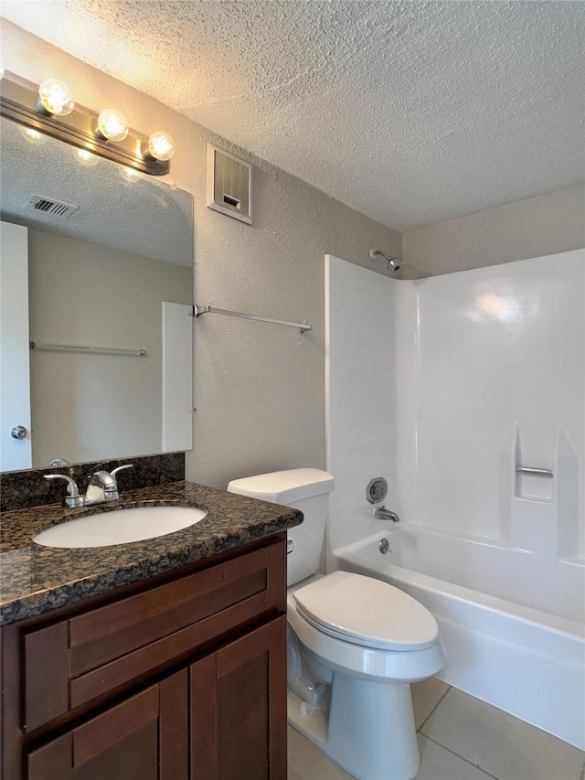 12991 Wirevine Ln, Houston, TX 77072 - bathroom featuring a textured ceiling, vanity, tub / shower combination, tile patterned flooring, and a textured wall