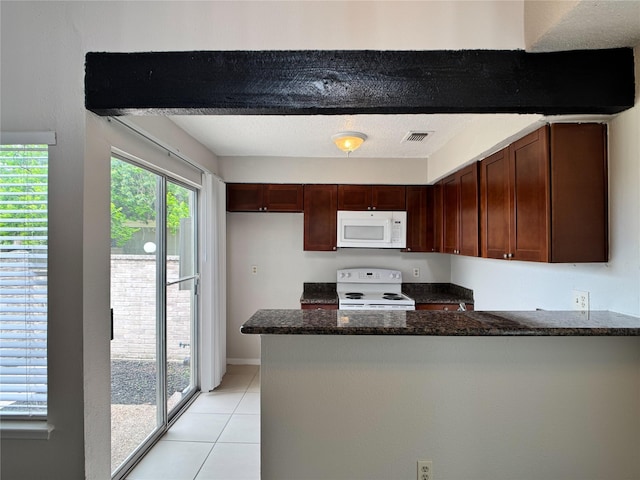 12991 Wirevine Ln, Houston, TX 77072 - kitchen with white appliances, a peninsula, light tile patterned flooring, and dark stone counters