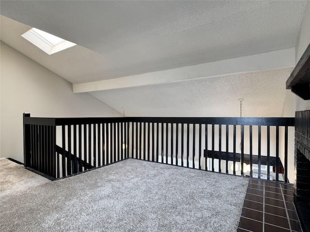 12991 Wirevine Ln, Houston, TX 77072 - corridor featuring a textured ceiling, a skylight, and carpet flooring