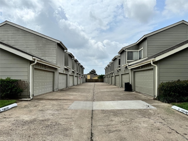 12991 Wirevine Ln, Houston, TX 77072 - view of concrete alley with community garages