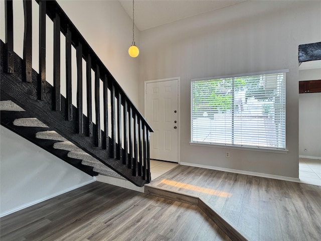 12991 Wirevine Ln, Houston, TX 77072 - entrance foyer with wood finished floors, a high ceiling, and stairway
