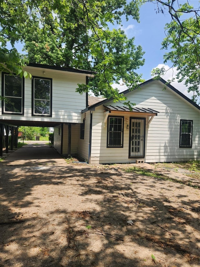 2926 Wimberly St, Houston, TX 77093 - view of front of house featuring concrete driveway and a carport