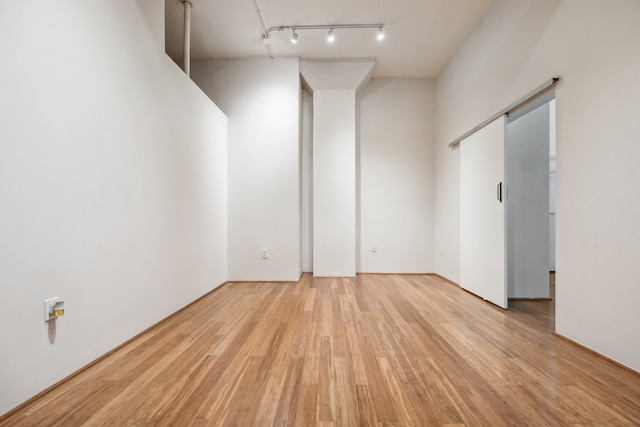 705 Main St Unit 302, Houston, TX 77002 - unfurnished room featuring light wood-style floors and track lighting