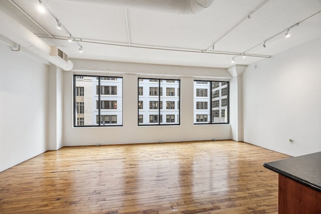 705 Main St Unit 302, Houston, TX 77002 - unfurnished room with track lighting and hardwood / wood-style floors