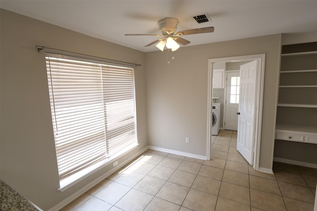 20246 Pittsford Dr, Katy, TX 77450 - spare room featuring washer / dryer, ceiling fan, and light tile patterned flooring