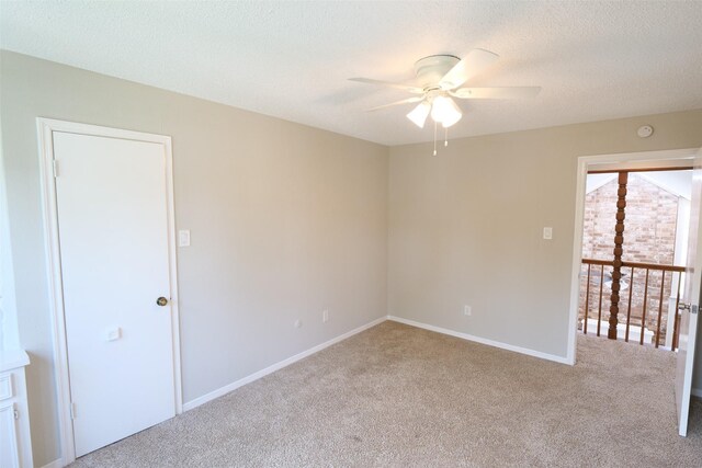 20246 Pittsford Dr, Katy, TX 77450 - carpeted empty room featuring a ceiling fan and a textured ceiling