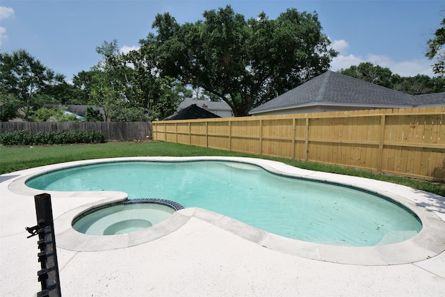 20246 Pittsford Dr, Katy, TX 77450 - view of swimming pool with a pool with connected hot tub and a fenced backyard