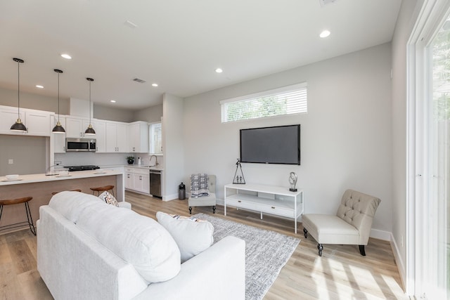 3310 Bremond St, Houston, TX 77004 - living area with recessed lighting and light wood-style floors
