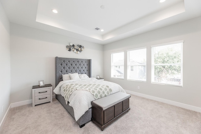 3310 Bremond St, Houston, TX 77004 - bedroom featuring a tray ceiling, recessed lighting, and light colored carpet