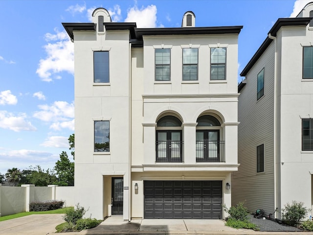 3303 Beverly Forest Dr, Houston, TX 77057 - view of front of house with stucco siding, driveway, and a garage