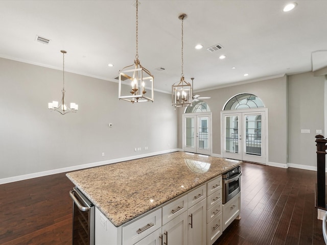 3303 Beverly Forest Dr, Houston, TX 77057 - kitchen with a chandelier, wine cooler, recessed lighting, oven, and a center island